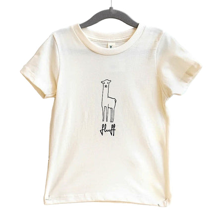 A beige t-shirt with a graphic of an alpaca and the brand name 'Fluff' below it, displayed on a hanger against a white wooden background.
