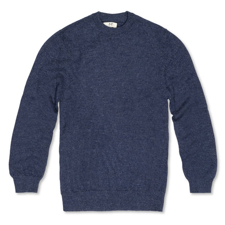 Men's Classic Crewneck 100% Baby Alpaca Sweater. A blue 100% baby alpaca crewneck sweater lying flat on a white background. 