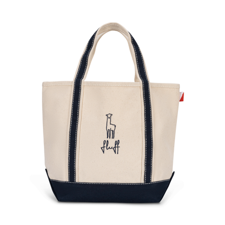 Off white tote bag with navy accents and 'fluff' logo on a white background
