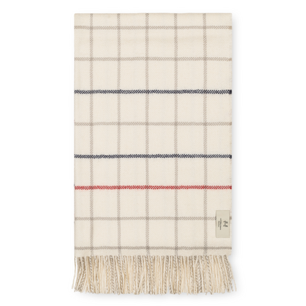 Plaid blanket with fringes on a white background